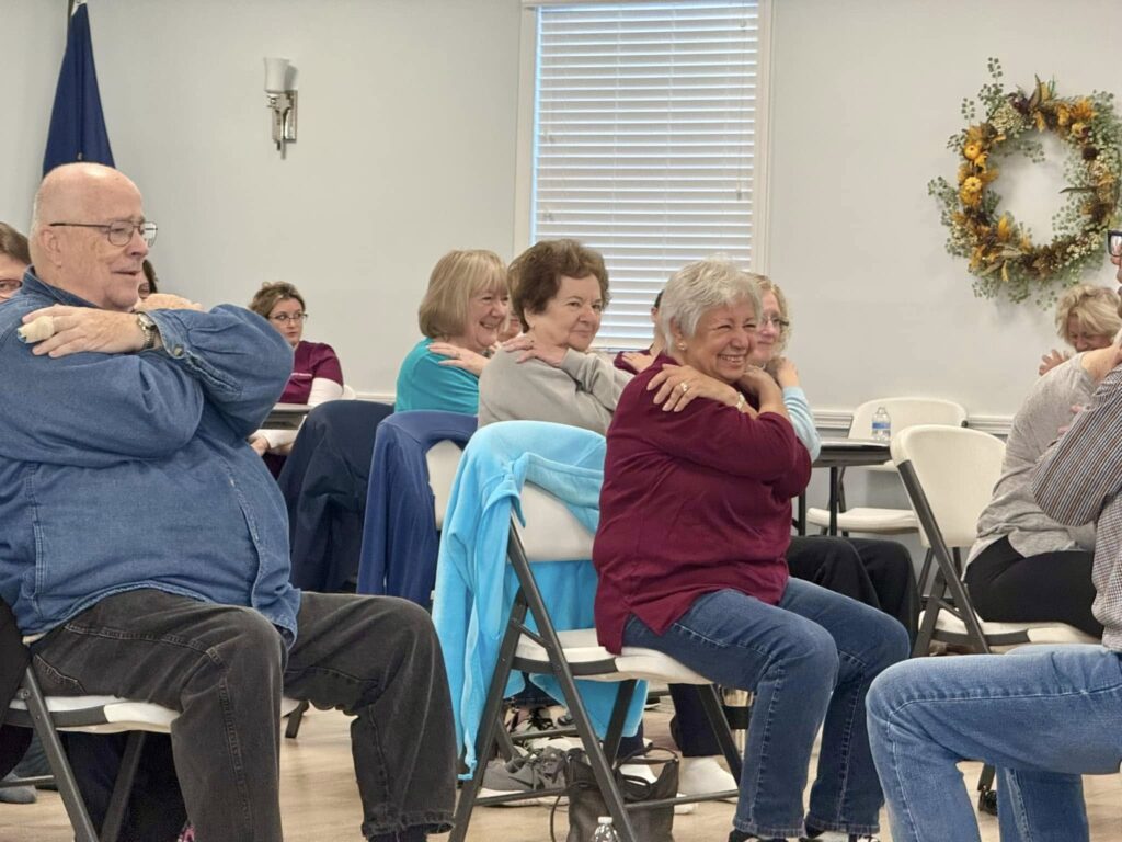 Seniors enjoying a group activity in a community room.